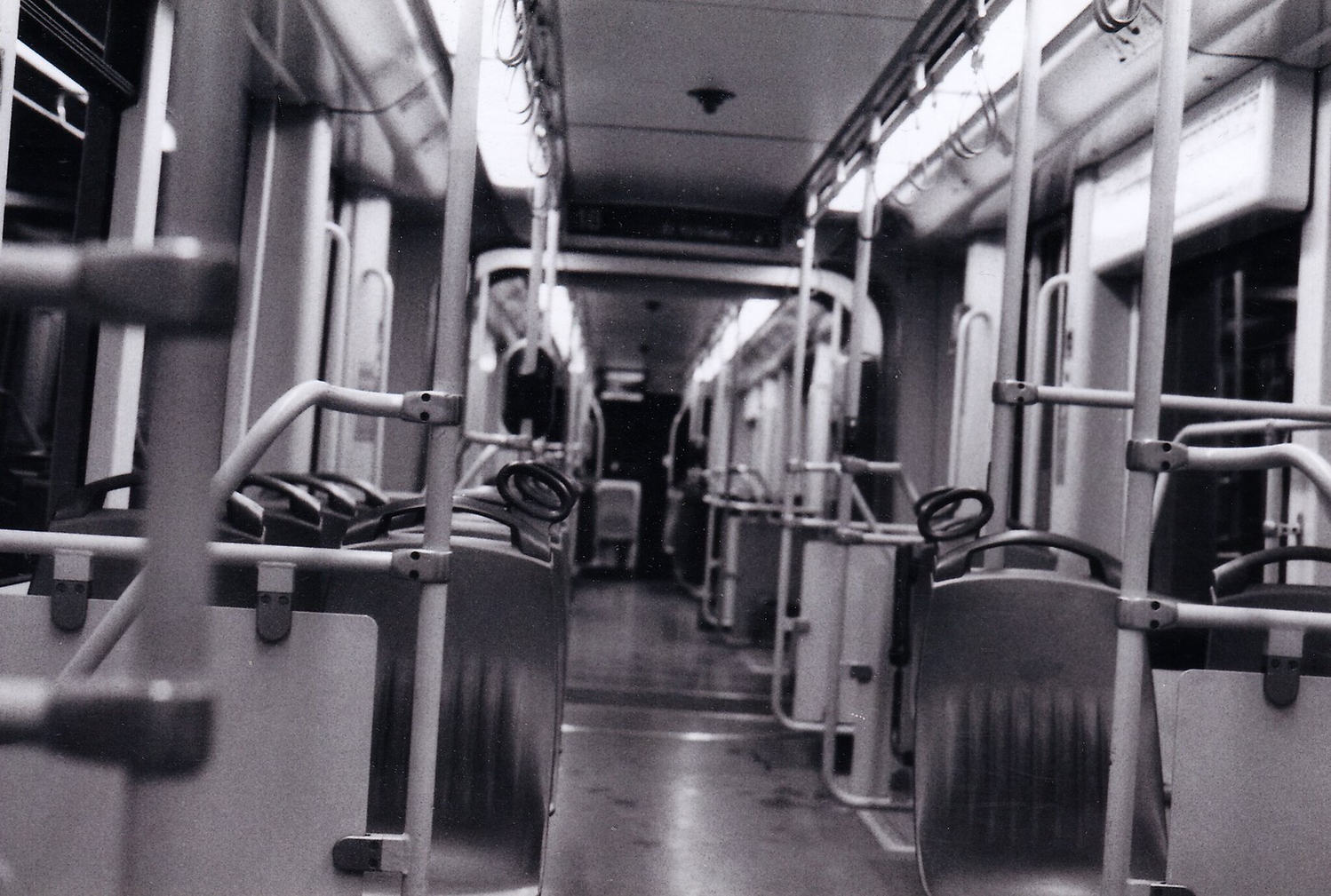 The inside of a tram in black and white